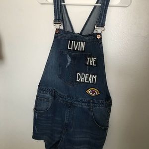 Overalls with writing